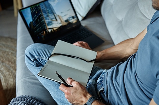 Man working on sofa