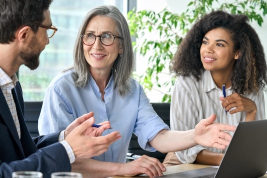 UserTesting diverse team discussing UX research objectives