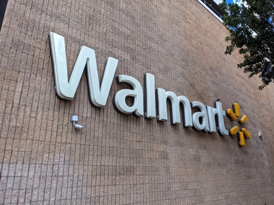 Walmart sign on wall of super store